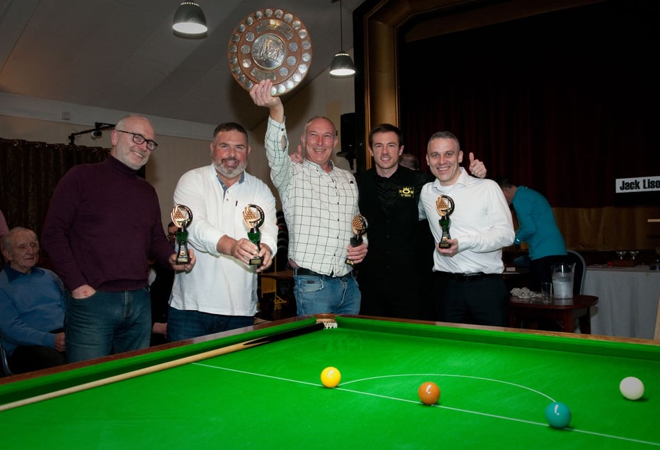 <p>Ian Etherington (centre, holding trophy) made a 59 break for new Division Two leaders Comrades A (Photo: Tim Hudson)</p>