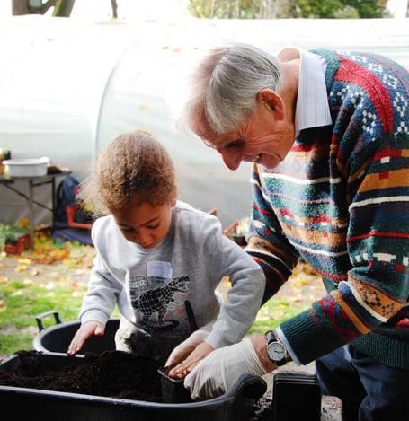 Kids planting bulbs for Farnham in Bloom