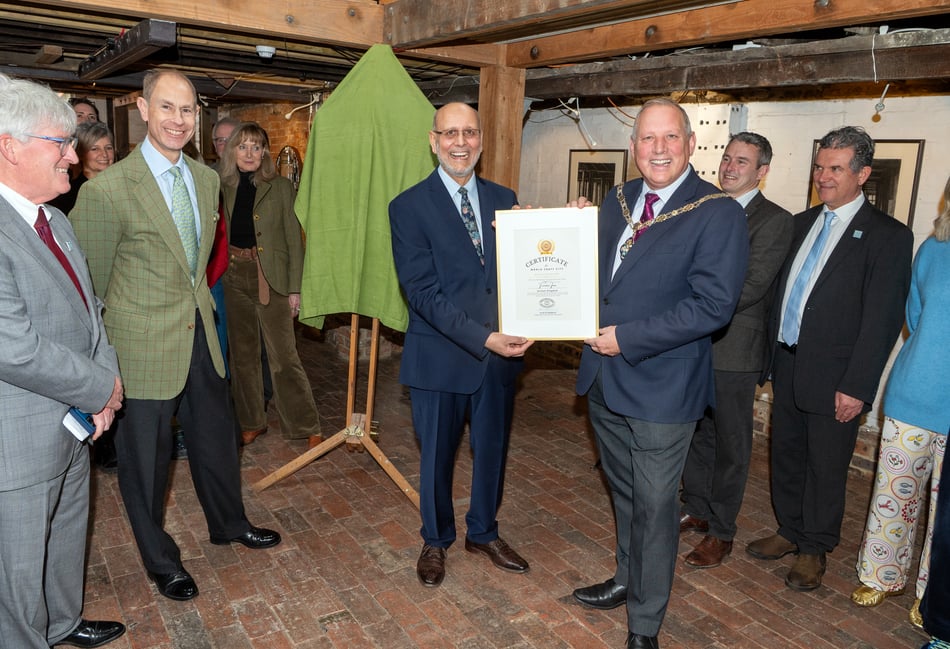 <p>Professor Aftab Gharda of the World Craft Council presents a certificate confirming Farnham's World Craft Town status to mayor, Cllr George Murray, in front of town clerk, Iain Lynch, and HRH The Duke of Edinburgh. (PIC ANDY NEWBOLD)</p>