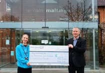 Farnham Musical group's £1,272 show of support for hospice