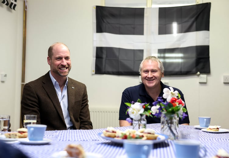 The Duke of Cornwall enjoys a scone (Picture: Andrew Parsons / Kensington Palace)
