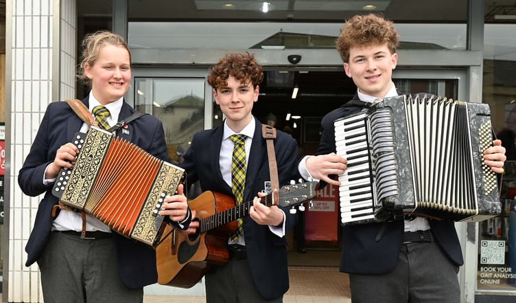 Truro School students Kez, Oliver and Buzz provide some music