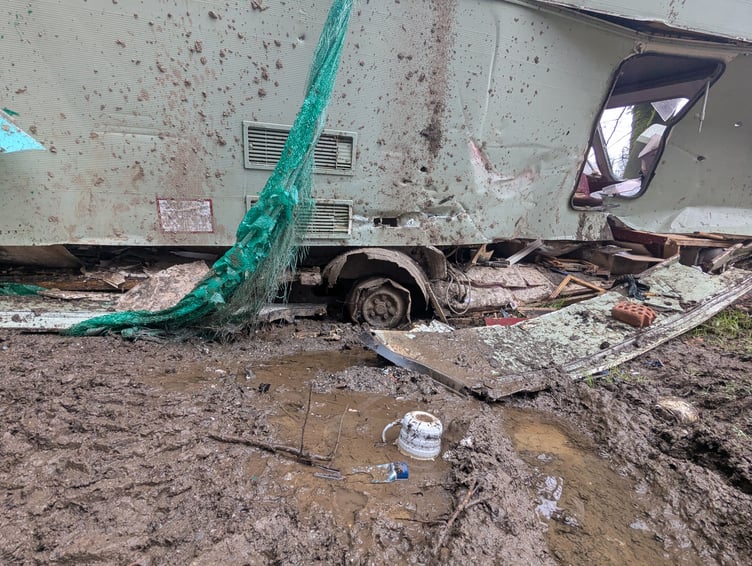 Debris surrounding the recently abandoned caravan.