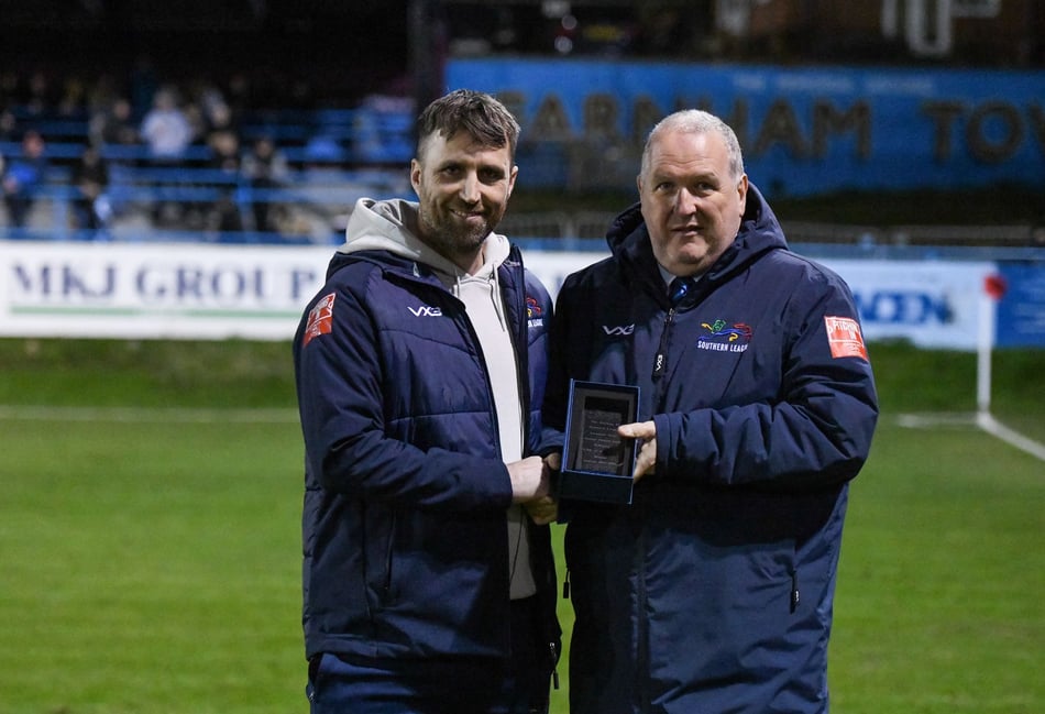 <p>Farnham Town manager Paul Johnson (left) receives the February PST Sport Club of the Month award from Southern League chairman David Martin</p>