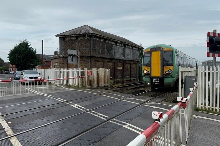 Southern train passing over Havant level crossing