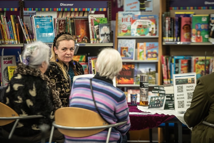 Sally Ann Melia describes her science fiction works at Farnham Library.