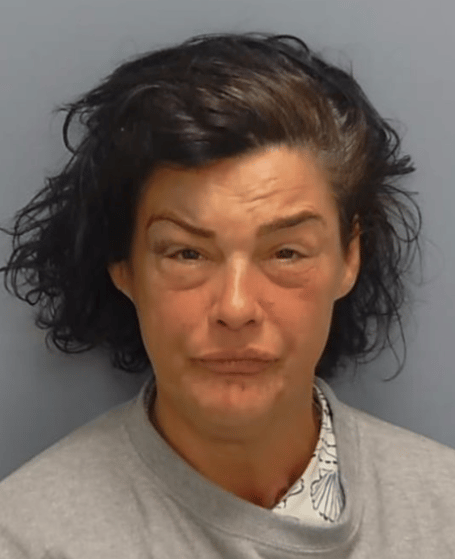 Julie Walls, 46, of Hogs Back, Seale, stole a pouch containing £1,000.