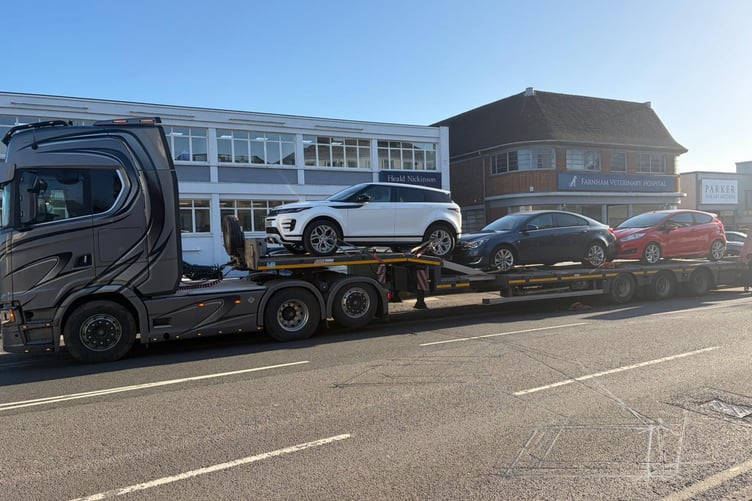 Vehicles being removed from PGI Garage in Guildford Road, Farnham.