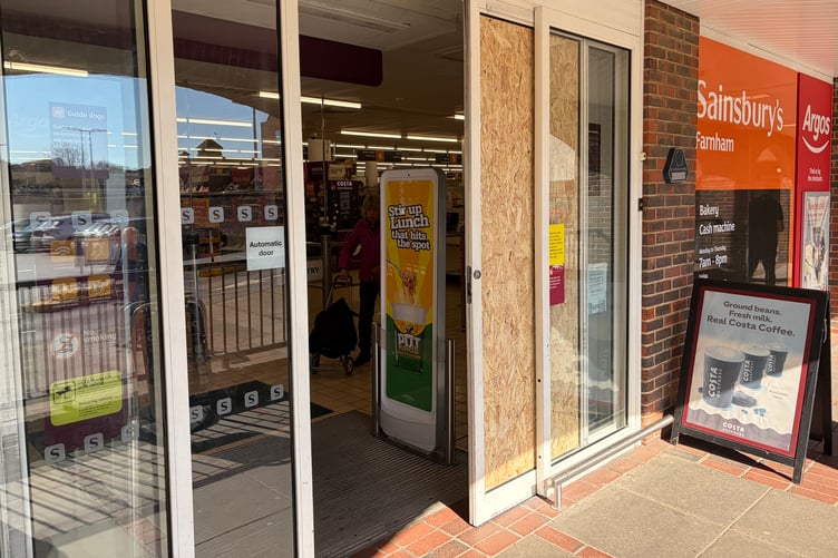 Sainsbury boarded up front door