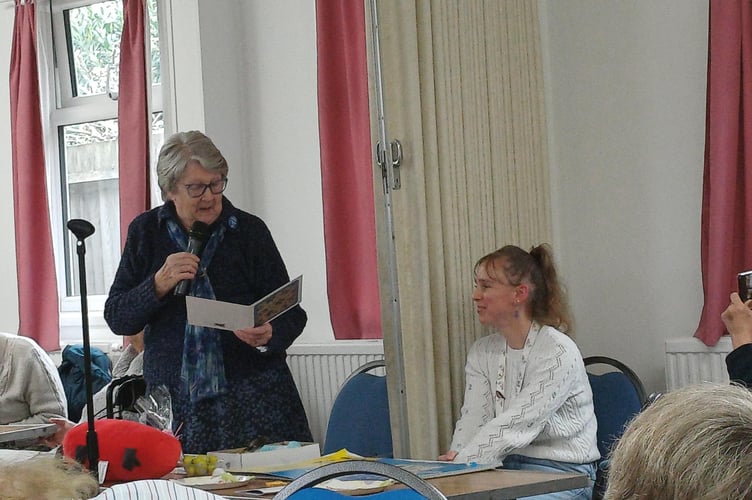 Alton Hard of Hearing Group founder Kate Dando addresses members at its 27th birthday party, March 2026.