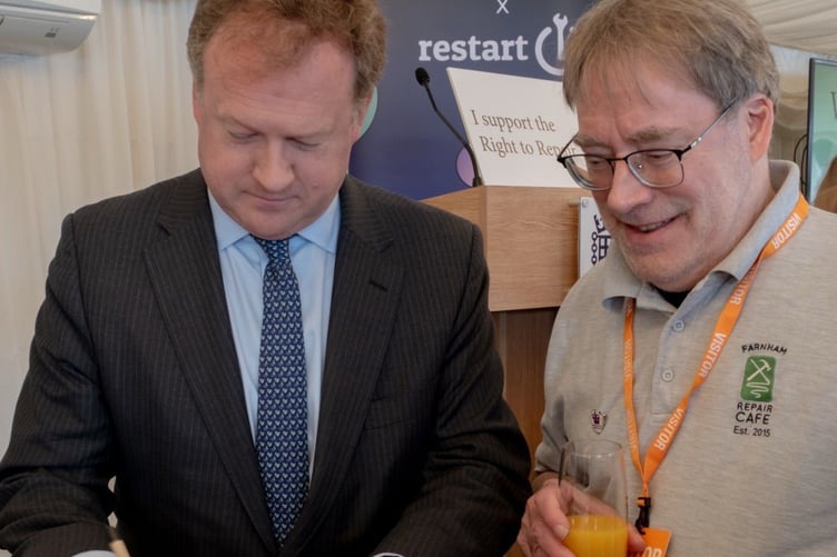 Greg Stafford with Professor Martin Charter signing the national Repair and Reuse Declaration
