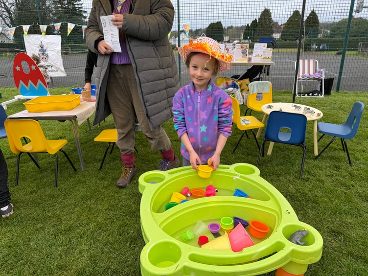 Bethany Grace-Goodwin enjoying play at the Churches Together in Lydney stall