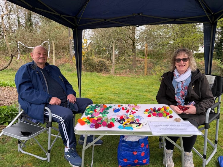 Steve and Tina helping out with small knitted orchard items