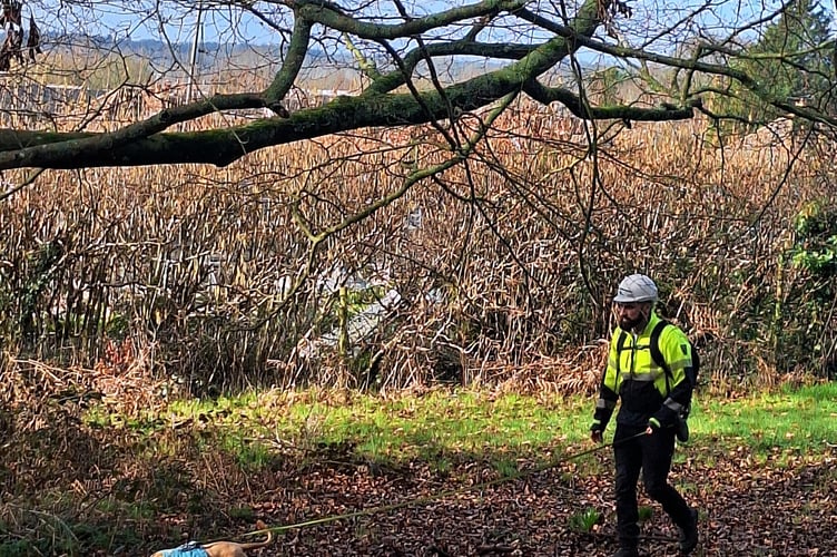 Lewis Worley and one of the Southern Water sniffer dogs.