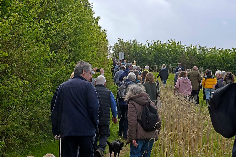 Hundreds of Protect Wellington demonstrators set off to walk public footpaths across farmland where developers want to build 250 houses. PHOTO: Alain Lockyer.