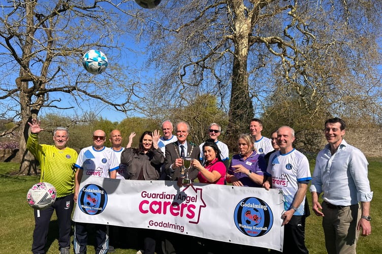 Godalming Town Mayor Bob Crooks MBE during his visit to the offices of Guardian Angels Carers Godalming to meet members of Godalming Walking Football Club.