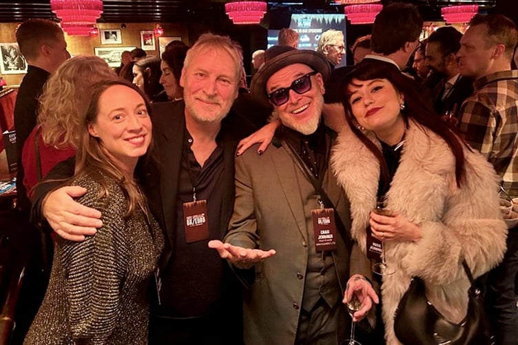 Korda Marshall, second left, with his daughter Summer, far left, and Craig Jennings, founder and CEO of Raw Power Management, which represents artists, with his daughter, Rosie, at Ronnie Scotts jazz club in London. //  A top music industry executive is auctioning off a haul of memorabilia - including a Red Hot Chili Peppers surfboard.  Korda Marshall - known as the 'A&R mans A&R man' - worked with huge names during his career including Muse, the Darkness and Gnarls Barkley.  Now, as he completes work on the latest Blondie album, he is selling a large part of his personal collection at Ewbanks in Guildford, Surrey on April 29.  Highlights include super rare acetate recordings and signed white label records from key rock and pop moments of the last 40 years.  Among the gold, silver and platinum discs, Kordas most treasured consignment is a Red Hot Chili Peppers surfboard, a promotional item for their ninth studio album, Stadium Arcadium. It has an estimate of £200-400.  All lots, often each containing collections of vinyl LPs, are priced under £1,000. 