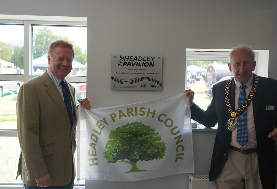 <p>Greg Stafford and Cllr Graham Hill unveil the plaque for Headley's refurbished Sport Pavillion</p>