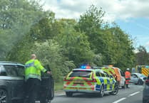 Delays on A31 Hogs Back after car and motorcycle collision