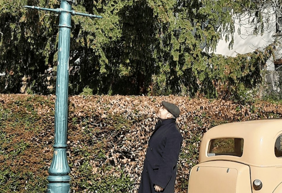 <p>Dickon Armstrong admires the gas lamp in 2023.</p>