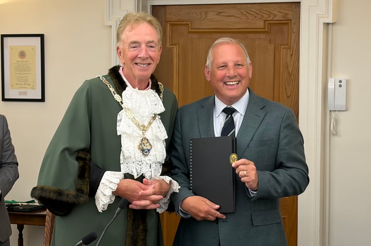 The new Farnham Town Mayor Cllr Graham White, and his predecessor Cllr George Murray.