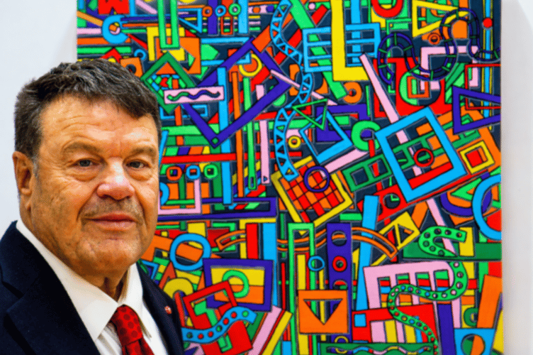 Tom Yendell with one of the paintings he submitted for the Association of Mouth and Foot Painting Artists' 70th birthday exhibition, 2026.