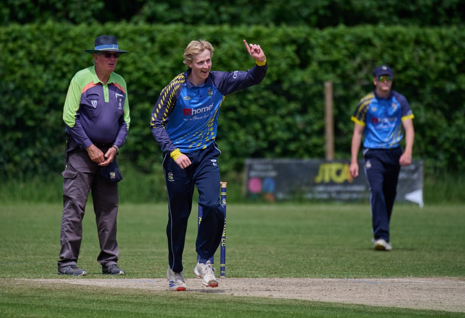 <p>Fred Egleston celebrates a wicket (Photo: Howard Gadsby)</p>