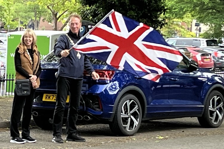 Farnham Mayor, Graham White and Lady Mayoress Judy White wave off the cars for their Parade through Farnham