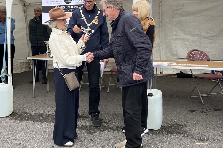Aileen Vilton presents the John Vilton Memorial Cup to the winner of the Post 1945 Class
