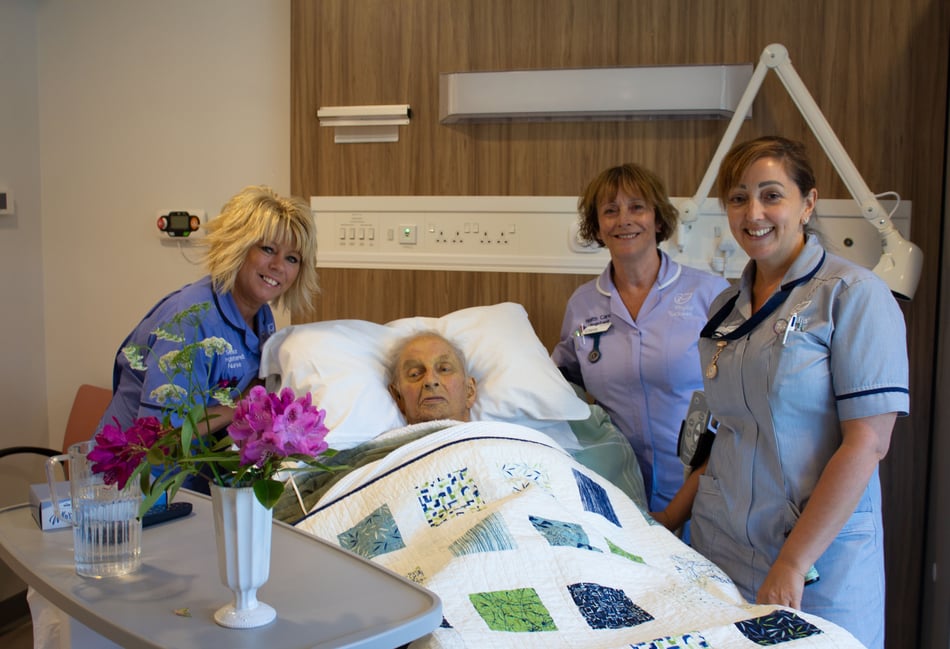<p>A patient and nursing staff at the new Phyllis Tuckwell Hospice in Farnham.</p>