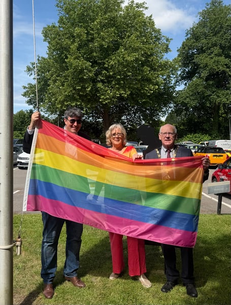 Waverley councillors Paul Follows, Penny Rivers and David Munro with the Pride flag.