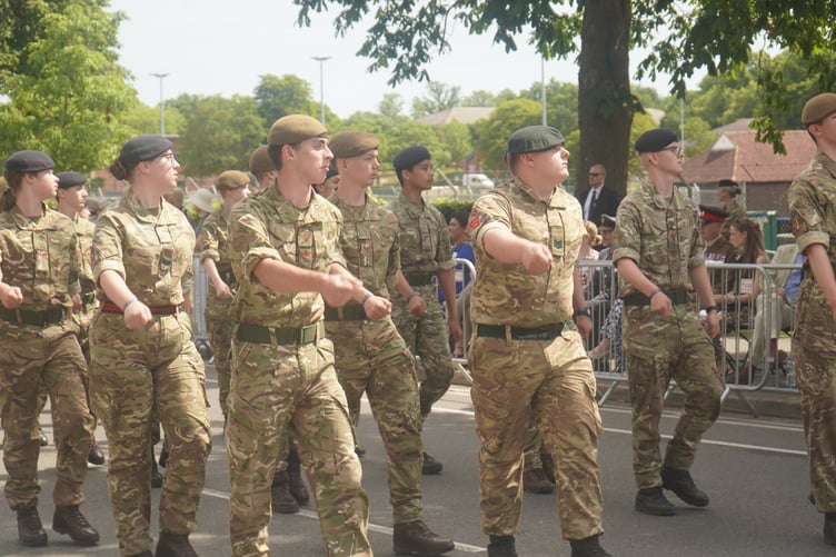 Troops march by during Armed Forces Day in Aldershot.
