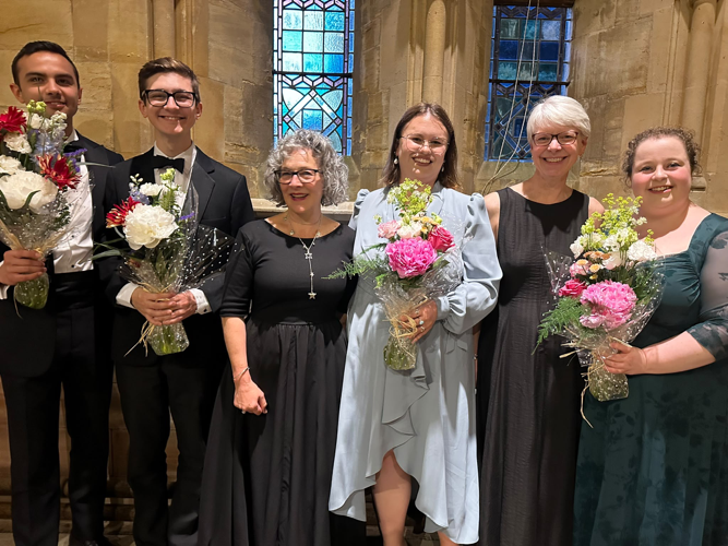 The soloists at the Froxfield Choir concert also received flowers. From left: Johannes Gerges, Dominic Skingle, Alice Howell and Rhian Davies, with Mary Snuggs and Sally Jay wearing black, Holy Trinity Church, Privett, June 20th 2026.