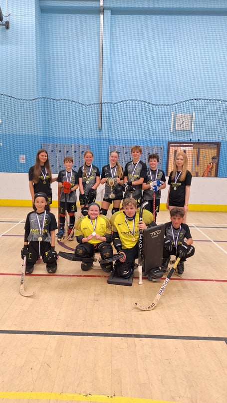 Farnham under-13 captain Annabel Page holds the cup
