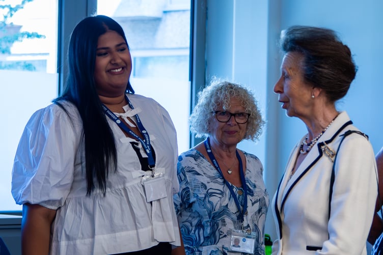 Princess Anne chats to staff at Citizens Advice Hart in Fleet.