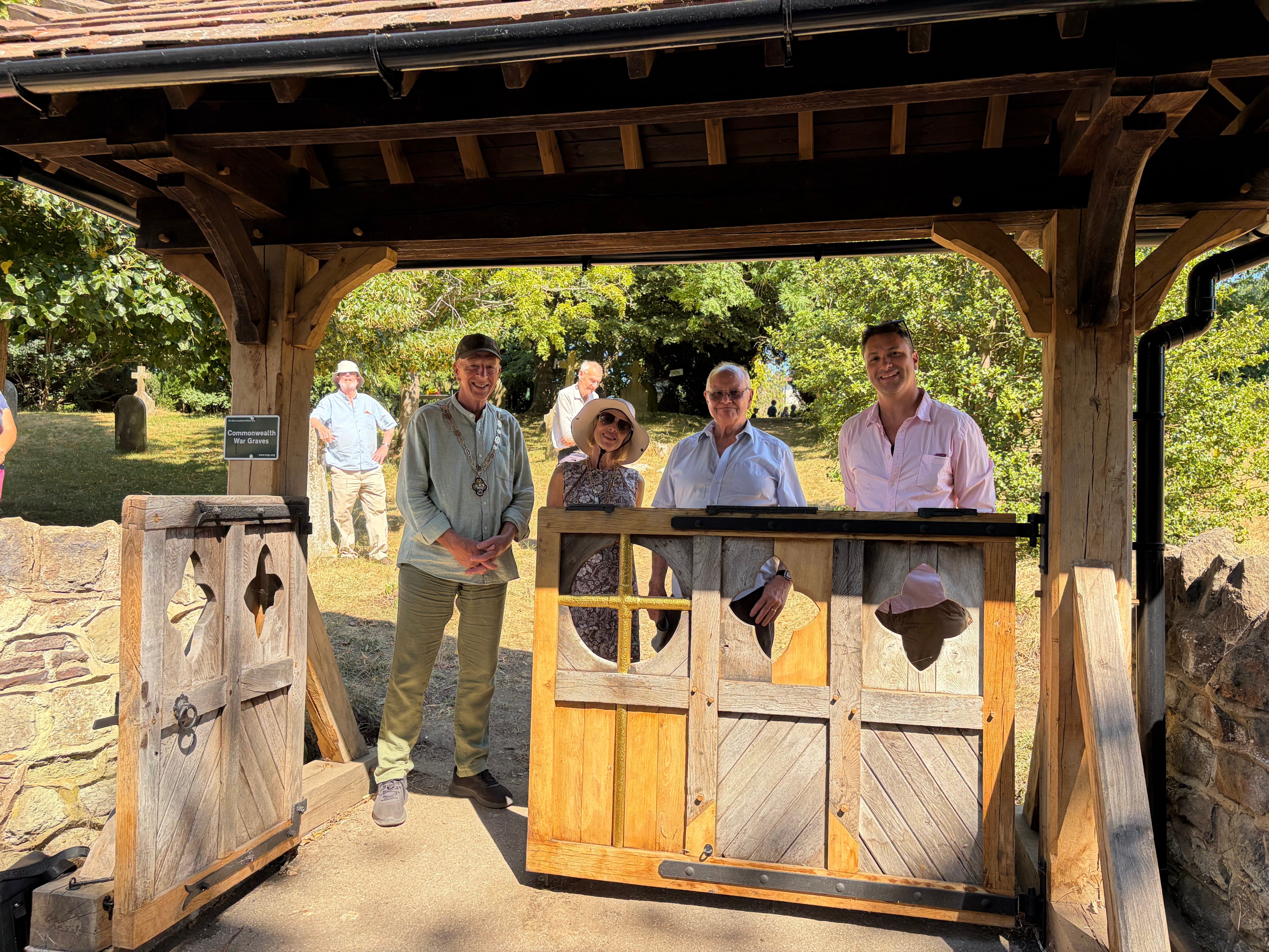 Mayor Graham White, Mayoress Mrs White, Gerald Blues and Danny the carpenter at Wrecclesham lychgate.