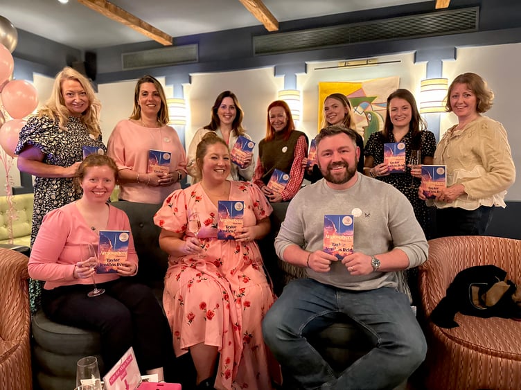 Candle and Page founder Nancy Underwood, centre front row, with members of the Haslemere book club.