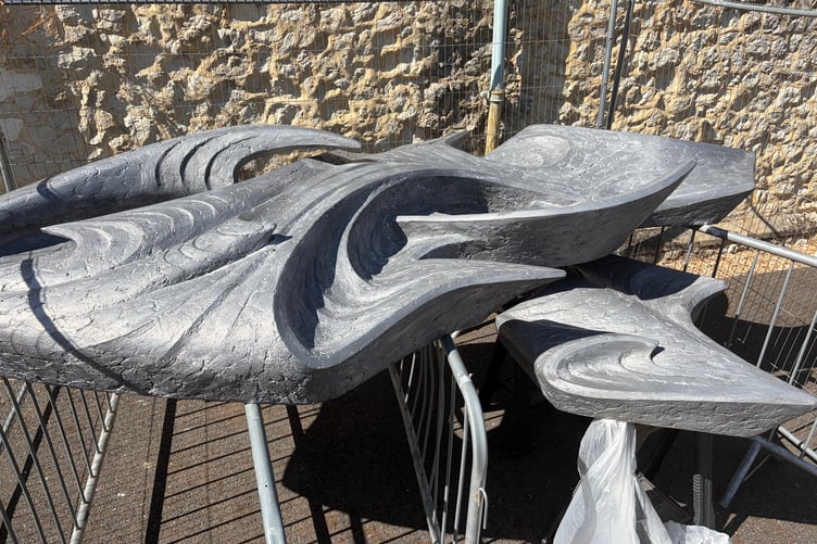 Woolmead flame sculpture outside West Street Cemetery