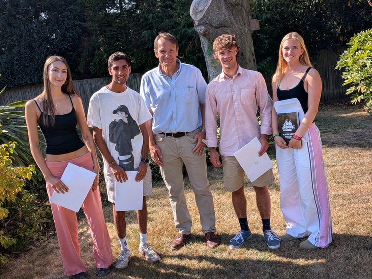 Churchers College retiring head Simon Williams with students on A-Level results day 2026.