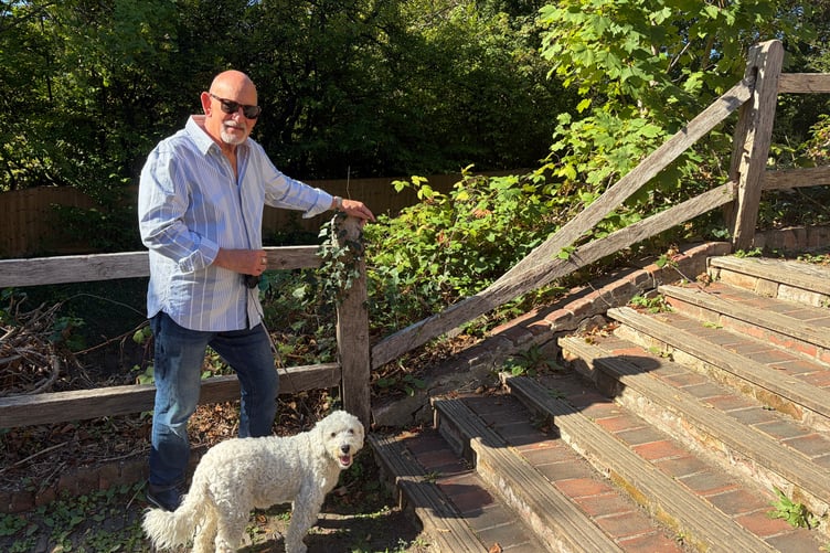 Cllr George Hesse next to Collapse railing at the Blind Bishops Steps