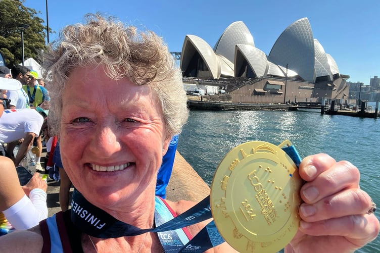 Linda Tyler with her Sydney Marathon medal