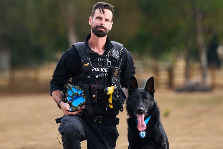 Surrey Police officer Eddie Cabrera and German Shepherd police dog Frankie.