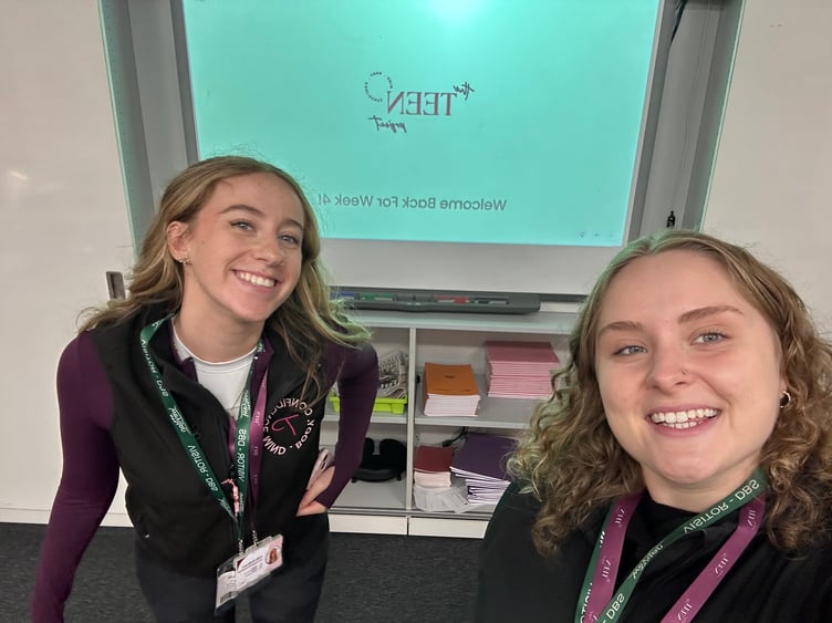Surrey student Evie Hope, right, with a fellow volunteer at The Teen Project